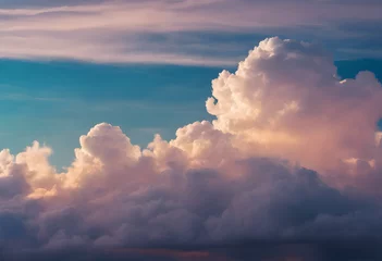Foto op Plexiglas Dramatic cumulus clouds at sunset with vibrant blue and orange hues, ideal for backgrounds or nature themes. © Tetlak