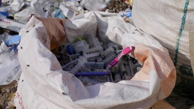 Nepal, Kathmandu, Nuwakot, medical waste at dump