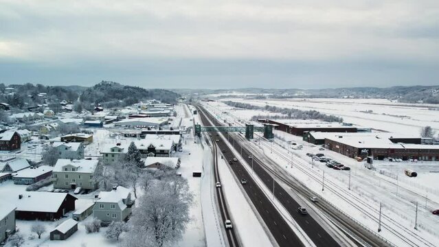 Train Station And Highway In Alvangen, Sweden. Aerial Shot