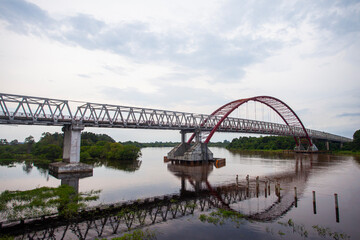 Fototapeta na wymiar Kahayan Bridge, icon and landmark of Palangka Raya city, the biggest bridge over Kahayan River.