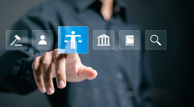 Law business concept. Businessman touching law icon on virtual screen for business legal advice, Labor law, Lawyer.
