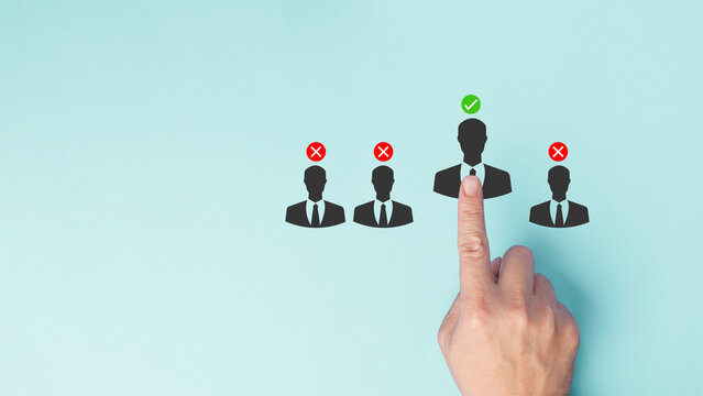 A hand points to a selection of candidate profiles, with cross mark and checkmark for correct hiring choice, decision making process in recruitment and human resources concept.