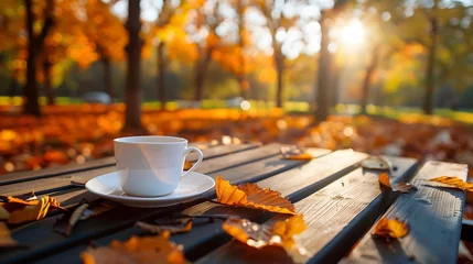 Foto op Plexiglas Empty table with coffee cup in golden fall park © James