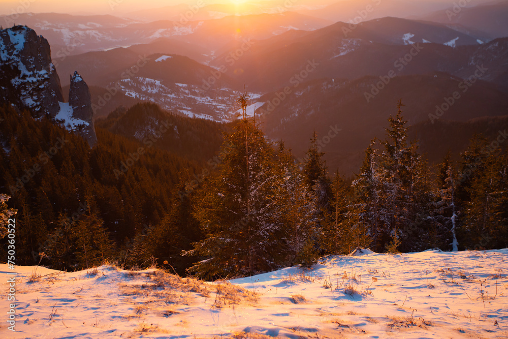 Wall mural beautiful sunrise at winter in ceahlau mountains, romania