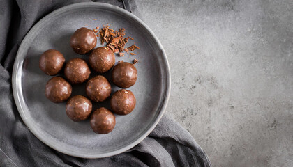 Chocolate truffles or Chocolate balls. top view of Chocolate truffles on grey plate with copy space, dessert, chocolate concept - obrazy, fototapety, plakaty