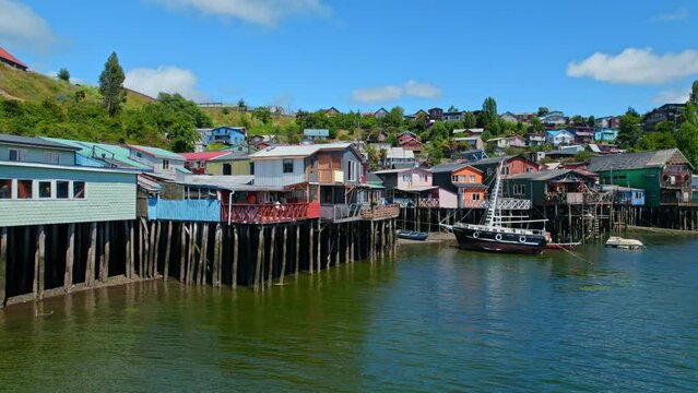 Colorful Traditional Stilt Houses In Castro, Chiloe Island, Chile 4K Drone Flyover