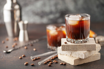 Black Russian cocktail with vodka and coffee liqueur in rocks. Homemade Alcoholic Boozy Black...