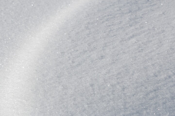 Curve of light on soft fresh white Christmas snow texture background