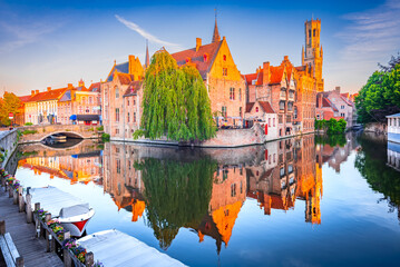 Bruges, Belgium. Rozenhoedkaai Canal in downtown of Brugge, sunrise colors. Famous Flanders destination. - obrazy, fototapety, plakaty