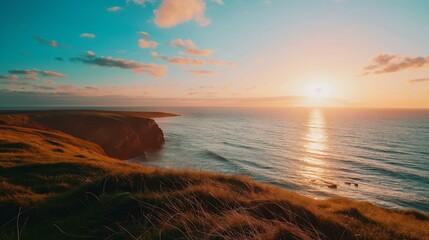 Majestic Coastal Sunset with Golden Light on Cliffs and Sea