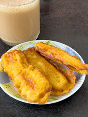 Tasty fried bananas served in plate, traditional Kerala Indian recipe.