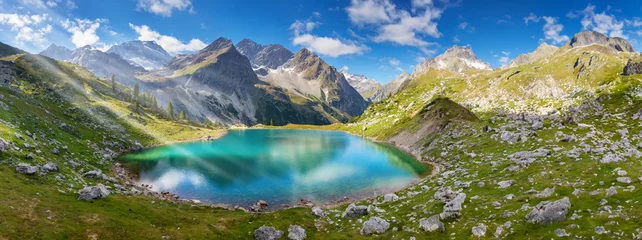 Fotobehang high mountain lake in the alps framed by high mountains, generated image © Mathias Weil