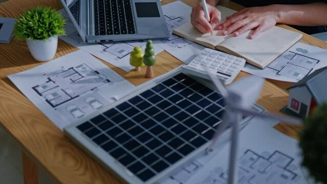 Working and calculate for cost estimating on paperworks and floor plan drawings about solar power energy system design to electricity and heat architectural and engineering for houses and buildings.