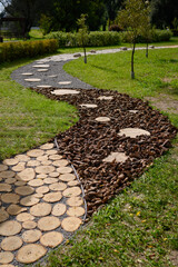 Massage tactile eco-path with different textures in the park, health path. Prevention of flat feet....