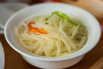 A bowl of Chinese food, fried shredded potatoes