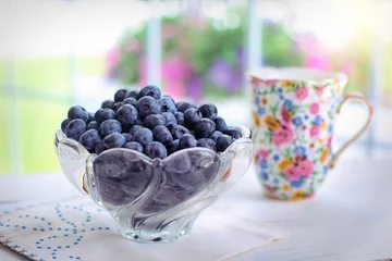 Fototapeten Sacred Indigo Symphony: Nourishing the Soul with a Bowl of Luscious Blueberries, Nature's Jewel of Tart Sweetness © toky