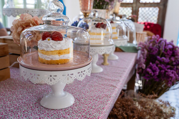 Different tasty sweet desserts on the table in the cafe.