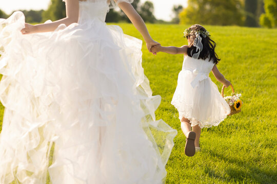 Beautiful bride with flower girl