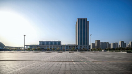 Modern City Skyline and Plaza in the Warm Light of Sunset