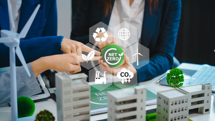 Sustainable business meetings at desks, green energy concepts. People in business suits discussing eco-friendly solutions, solar cells, wind turbines, and promoting net-zero practices. - obrazy, fototapety, plakaty