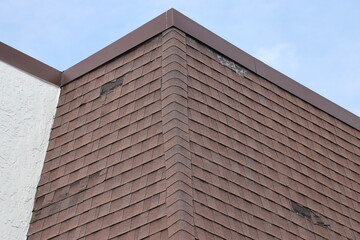 Damaged and Missing Shingles on Mansard Roof - Corner View