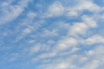 Blue sky background with tiny clouds. Atmosphere background or wallpaper