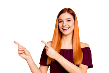 Close up portrait of cheerfully laughing young woman showing by her fingers on yellow background with copy space for text