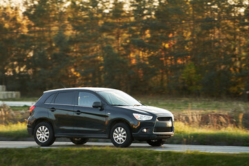 Fototapeta na wymiar Sport utility vehicle on the road. A luxury car for sport and travel. SUV is the new most wanted type of car amongst all markets.