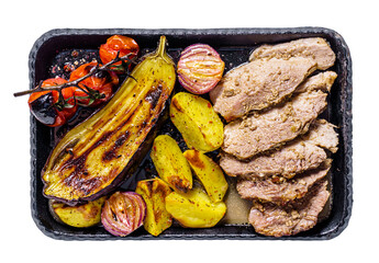 Grilled vegetables with meat on a cast iron trey isolated - 750437902