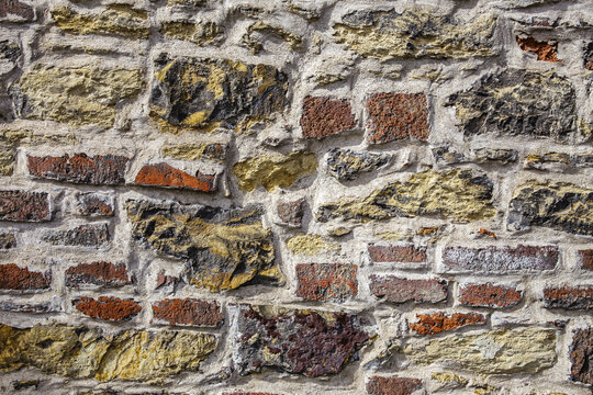 Vintage rustic bricks and stones create the texture of the stone cladding.