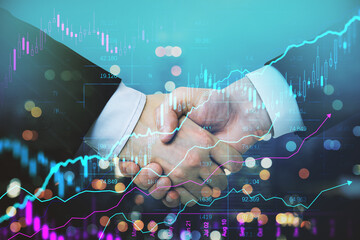 creative handshake and forex chart on blurry bokeh night city backdrop. Financial growth and...