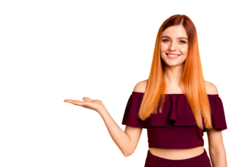 Red straight-haired attractive cute nice cheerful young girl, showing holding copy space on palm. Isolated over bright vivid yellow background
