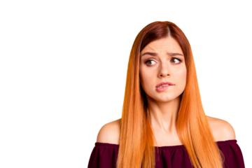 Red straight-haired attractive cute nice scared young girl, biting lip. Copy space. Isolated over bright vivid yellow background