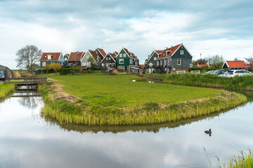 Panorama landscape with traditional houses near Marken on the IJsselmeer in the Netherlands. Municipality of Waterland in the province of North Holland.