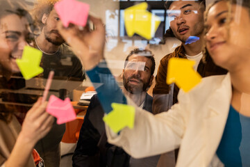 Multiracial business colleagues planning strategy in meeting at office