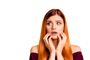 Oh no! Human emotions concept. Close up portrait of confused beautiful woman with open mouth big eyes isolated on yellow background. Young scared girl touch one's face with hands and look aside