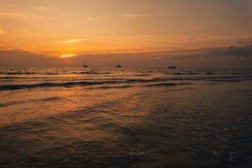 Orange beach at summer dusk on the island