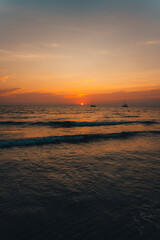 Obraz premium Orange beach at summer dusk on the island