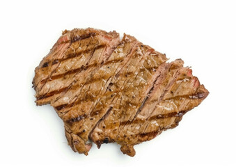 Top-down view of minimally seasoned carne asada sliced and isolated on a white background. Grilled beef steak concept for menu design and culinary websites