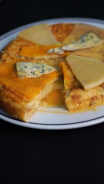 Potato omelette with cheese video, video of how food is handled to be served