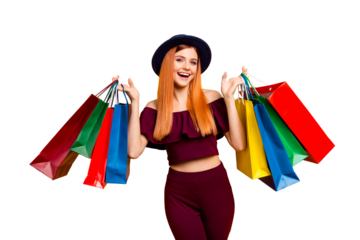 Black friday! Happy model girl returns from shopping mall holding colorful bags isolated on yellow background
