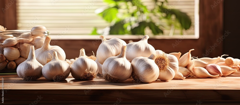 Aufkleber aromatic garlic bulbs displayed on a wooden table in a rustic kitchen setting