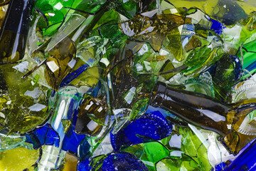 Pile of shattered bottles different colors
