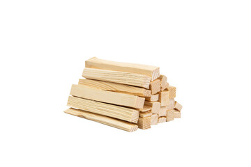 Dry slim firewood chopped and stacked on white background