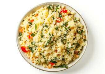 Tabbouleh salad with couscous, fresh parsley, and diced tomatoes in a bowl, top view isolated on white background. Middle Eastern cuisine concept