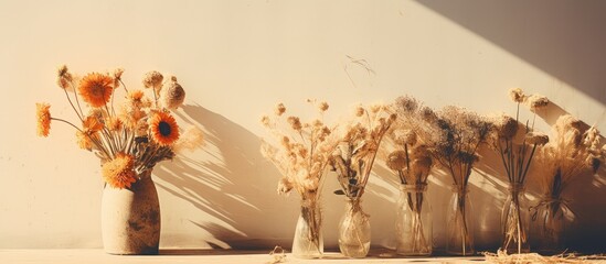Rustic Charm: Assorted Dried Blossoms Adorn a Vintage Glass Vase on a Sunny Day