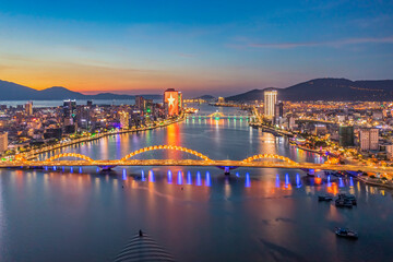 Dragon bridge at sunset which is considered as the icon of Da Nang city, Vietnam. Near Golden...