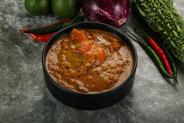 Indian cuisine - chicken curry with spices