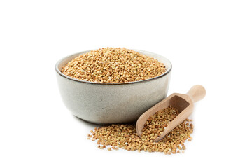 Green buckwheat in a bowl isolated on a white background. Superfood. Raw buckwheat porridge. Healthy vegan food, eco products, diet, organic.