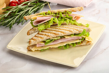 Homemade club sandwich with ham and cheese